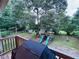 Back deck view overlooking a spacious backyard featuring a playset and storage shed at 4007 Stacy Ln, Snellville, GA 30039