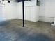 Basement with concrete floors, a support beam, and closet at 4007 Stacy Ln, Snellville, GA 30039