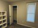 Bedroom featuring one window, a closet with an open door, gray walls and carpet at 4007 Stacy Ln, Snellville, GA 30039