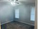 Bedroom with neutral colored walls, carpeted floors, and windows with blinds, illuminated by a ceiling fan at 4007 Stacy Ln, Snellville, GA 30039