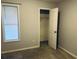 Bedroom with one window, closet with open door, carpet and light colored walls at 4007 Stacy Ln, Snellville, GA 30039