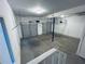 Spacious two car garage with two overhead doors and concrete flooring at 4007 Stacy Ln, Snellville, GA 30039