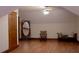 Finished attic space with hardwood floors, a mirror, seating and a door at 4640 Calleigh Way, Snellville, GA 30039