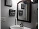 A well-lit bathroom featuring a modern mirror and vanity at 4640 Calleigh Way, Snellville, GA 30039