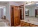Bright bathroom featuring double sinks, vanity, tile floor, and large soaking tub at 4640 Calleigh Way, Snellville, GA 30039