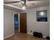 Bedroom features a ceiling fan, wood floors, and natural light from the window at 4640 Calleigh Way, Snellville, GA 30039