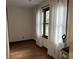 Bedroom with wood floors, wood trim, and a white curtain at 4640 Calleigh Way, Snellville, GA 30039