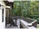 Exterior view of a large deck with railings and steps, providing access to a backyard sanctuary at 4640 Calleigh Way, Snellville, GA 30039