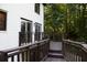 Exterior of home featuring a spacious deck overlooking trees, great for relaxing outdoors at 4640 Calleigh Way, Snellville, GA 30039