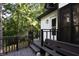 A large deck view, with railings and bench seating along with ample greenery around at 4640 Calleigh Way, Snellville, GA 30039