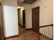 Hallway with wood floors, wooden door frames, and a banister at 4640 Calleigh Way, Snellville, GA 30039