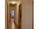 Hallway with wood floors, wooden door frames, and wooden closet door at 4640 Calleigh Way, Snellville, GA 30039