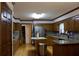 Spacious kitchen featuring wooden cabinets, granite counters, an island, and stainless steel appliances at 4640 Calleigh Way, Snellville, GA 30039