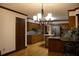 A chef's kitchen with ample counter space, wooden cabinets and modern appliances at 4640 Calleigh Way, Snellville, GA 30039