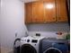 Convenient laundry room with modern appliances and plenty of cabinet space at 4640 Calleigh Way, Snellville, GA 30039