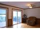 Inviting living room with sliding doors to deck, natural light and comfortable seating at 4640 Calleigh Way, Snellville, GA 30039