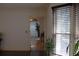 View of the living room featuring black tile flooring, a window, and a plant at 4640 Calleigh Way, Snellville, GA 30039