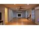 Large living room boasts a fireplace, hardwood floors, ceiling fans, and neutral paint at 4640 Calleigh Way, Snellville, GA 30039