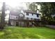 Stunning rear exterior with a large deck, perfect for outdoor entertaining at 4640 Calleigh Way, Snellville, GA 30039