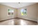 Bright bedroom featuring a ceiling fan, neutral walls, and two windows letting in natural light, enhancing the inviting feel at 1321 Mcclelland Ave, Atlanta, GA 30344