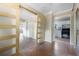 Hallway with sliding barn doors leads to kitchen and bedroom with luxury vinyl plank flooring at 1321 Mcclelland Ave, Atlanta, GA 30344