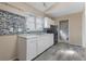 Updated kitchen with white cabinets, marble countertops, unique backsplash, and modern appliances, ready for gourmet meals at 1321 Mcclelland Ave, Atlanta, GA 30344