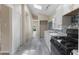 The updated kitchen boasts white cabinets, modern appliances, and sleek countertops, ready for gourmet meals at 1321 Mcclelland Ave, Atlanta, GA 30344