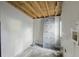 Unfinished room with exposed ceiling beams, walls, and insulation boards, ready for customization at 1321 Mcclelland Ave, Atlanta, GA 30344