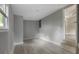 Spacious room with gray walls, luxury vinyl plank floors, baseboard trim, and a window at 1321 Mcclelland Ave, Atlanta, GA 30344