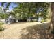 Lawn view of the home showcasing a large lot and mature trees at 1321 Mcclelland Ave, Atlanta, GA 30344