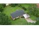 Aerial view of a cozy home with a well-maintained lawn, carport, and mature trees at 1342 Peggy Nw Ln, Conyers, GA 30012