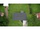 Aerial view of home showcasing roof, driveway, and well-maintained lawn at 1342 Peggy Nw Ln, Conyers, GA 30012