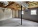 Unfinished basement offers potential for various uses, with concrete walls and visible utilities at 1342 Peggy Nw Ln, Conyers, GA 30012