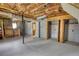 Partially finished basement, offering storage options, shelving, and potential for customization at 1342 Peggy Nw Ln, Conyers, GA 30012