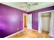 Bedroom featuring hardwood floors, a ceiling fan, and a closet at 1342 Peggy Nw Ln, Conyers, GA 30012