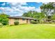 Charming single-story home with a lush green lawn and a convenient carport at 1342 Peggy Nw Ln, Conyers, GA 30012