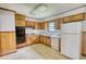 Kitchen with ample cabinet space and white appliances for easy meal preparation at 1342 Peggy Nw Ln, Conyers, GA 30012