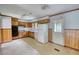 Functional kitchen with wood cabinets, white appliances, and a convenient exterior door at 1342 Peggy Nw Ln, Conyers, GA 30012