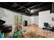 Large basement area with hardwood floors, suitable for multiple activities and storage at 1496 Meadowlark Dr, Decatur, GA 30032