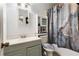 Full bathroom features vanity with sink, toilet, and tub with shower curtain at 1496 Meadowlark Dr, Decatur, GA 30032