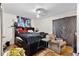 Bedroom with hardwood floors, ceiling fan, and dark furniture at 1496 Meadowlark Dr, Decatur, GA 30032