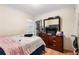 Bedroom featuring a double bed with bedding, natural light, and an ample dresser at 1496 Meadowlark Dr, Decatur, GA 30032