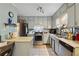Updated kitchen featuring stainless steel appliances, tile backsplash, and ample cabinet space at 1496 Meadowlark Dr, Decatur, GA 30032