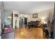 Cozy living room with hardwood floors and fireplace, open to the kitchen and dining area at 1496 Meadowlark Dr, Decatur, GA 30032