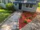 Curb appeal featuring rock and mulch landscaping around the exterior of the home at 2436 Clarissa Nw Dr, Atlanta, GA 30318
