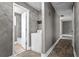 Hallway leads to bathroom and living spaces, featuring a washing machine and neutral colors at 2436 Clarissa Nw Dr, Atlanta, GA 30318