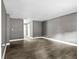 Open-concept living room featuring modern gray walls and durable wood-look floors at 2436 Clarissa Nw Dr, Atlanta, GA 30318