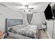 Bedroom featuring a bed and a TV above a small bedside table at 1324 Almont Sw Dr, Atlanta, GA 30310
