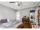 Bedroom featuring a bed, ceiling fan, wooden floor and a view of the hallway at 1324 Almont Sw Dr, Atlanta, GA 30310