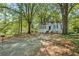 Charming home with a lovely front yard and mature trees, creating a serene setting at 1324 Almont Sw Dr, Atlanta, GA 30310